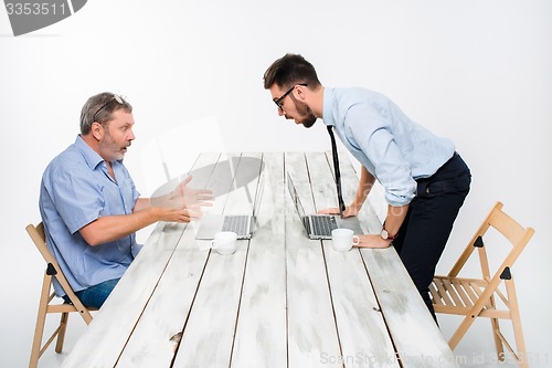 Image of The two colleagues working together  at office on gray background