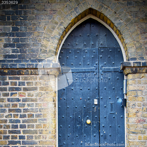 Image of wooden parliament in london old church door and marble antique  