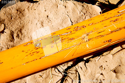 Image of cracked sand in   desert abstract macro bark