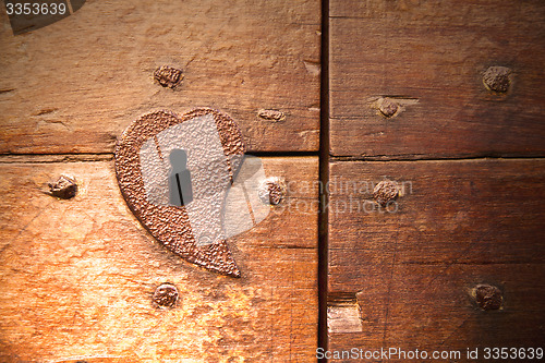 Image of   brown knocker and wood  door castiglione  