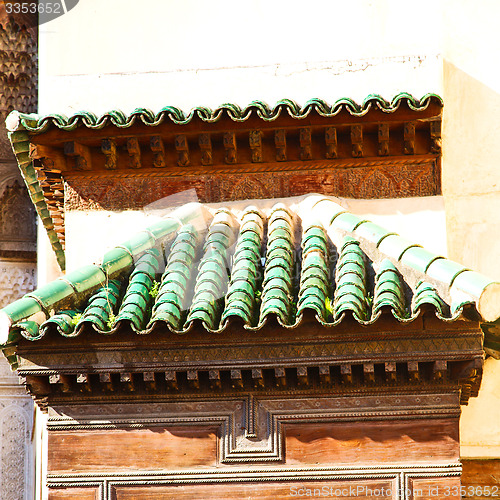 Image of tile roof  moroccan old wall and brick in antique city