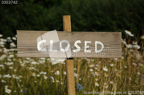 Image of Closed written at a wooden sign