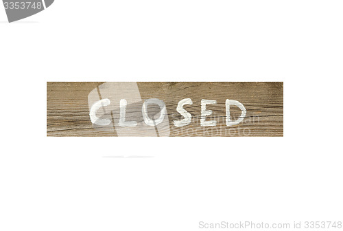 Image of Closed written at a wooden sign