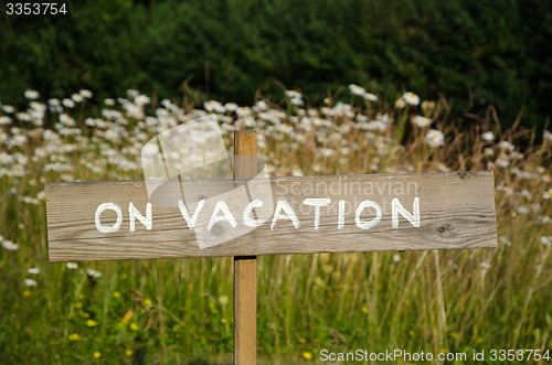 Image of On Vacation wooden sign