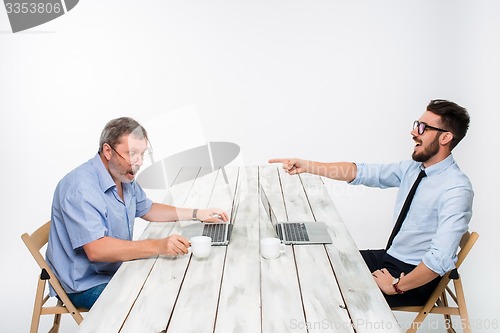 Image of The two colleagues working together at office on white background