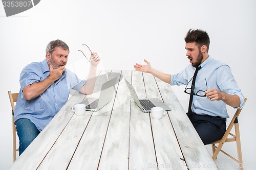 Image of The two colleagues working together at office on white background