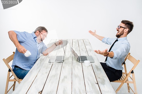 Image of The two colleagues working together at office on white background