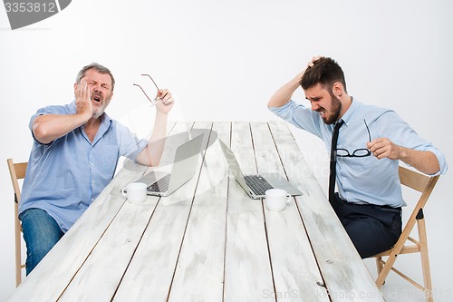 Image of The two colleagues working together at office on white background