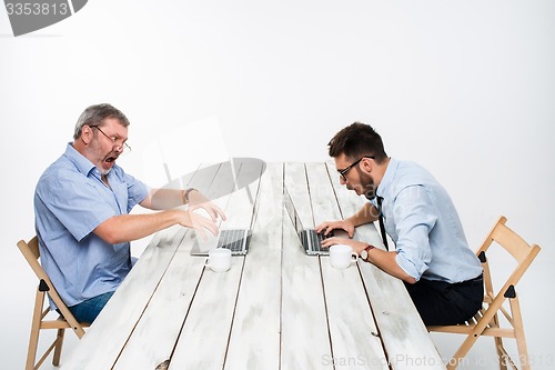 Image of The two colleagues working together at office on white background