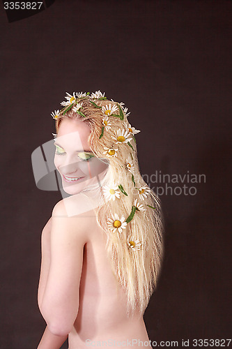 Image of Happy Bare Woman with Flowers on her Blond Hair