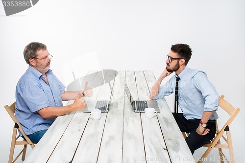 Image of The two colleagues working together at office on white background