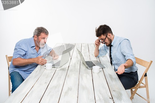 Image of The two colleagues working together at office on white background