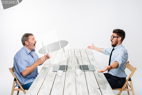 Image of The two colleagues working together at office on white background