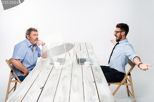 Image of The two colleagues working together at office on white background