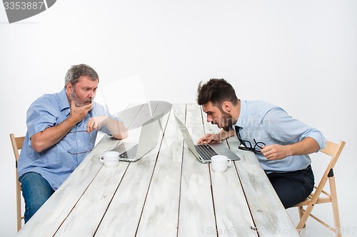 Image of The two colleagues working together at office on white background