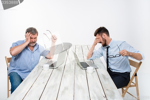 Image of The two colleagues working together at office on white background