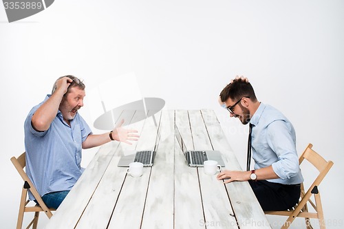 Image of The two colleagues working together at office on white background