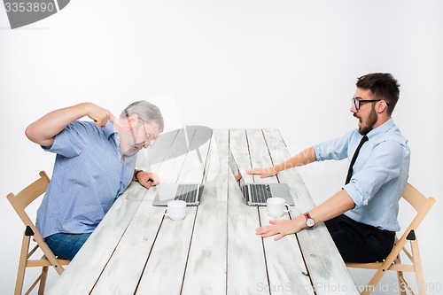 Image of The two colleagues working together at office on white background