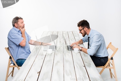 Image of The two colleagues working together at office on white background