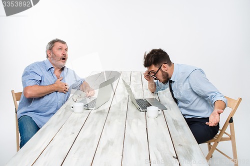 Image of The two colleagues working together at office on white background