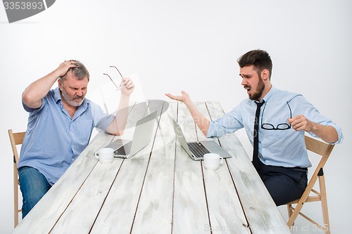 Image of The two colleagues working together at office on white background