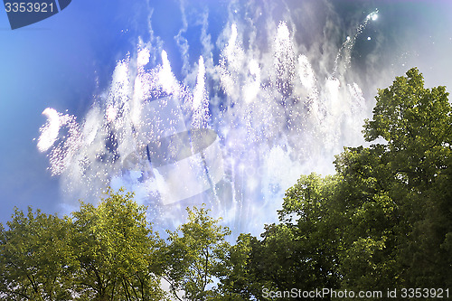 Image of bright fireworks by day