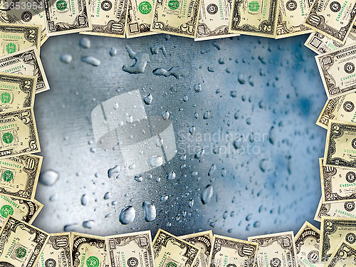 Image of Frame from the dollars on the surface with drops