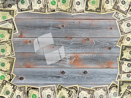Image of Frame from the dollars on the wooden board