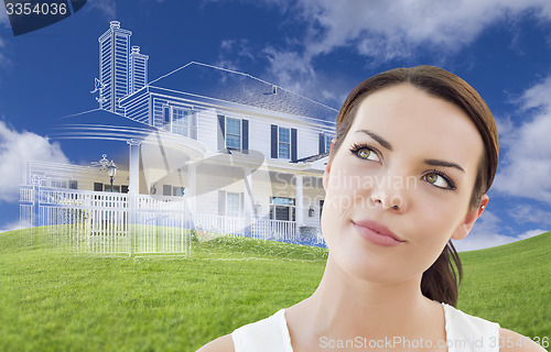 Image of Mixed Race Female Looks Over to Ghosted House Drawing Behind