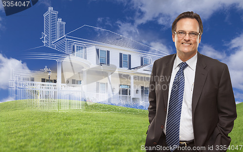 Image of Smiling Businessman with Ghosted House Drawing Behind