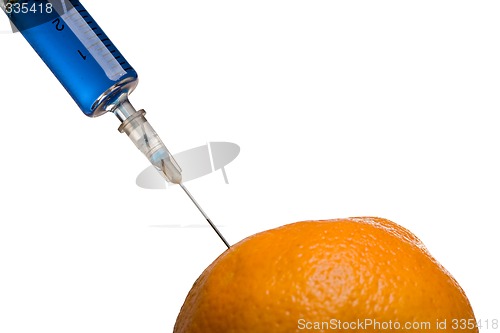 Image of Glass syringe and orange