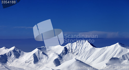 Image of Snowy mountains at sunny day. Panoramic view