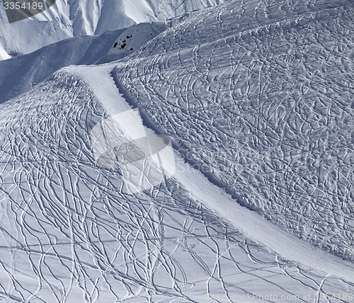 Image of Off-piste and groomed slope with trace from ski and snowboards