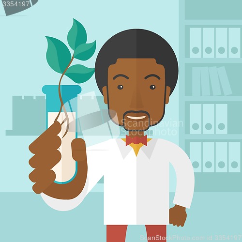 Image of Black guy Chemist with tube and eco leaves.