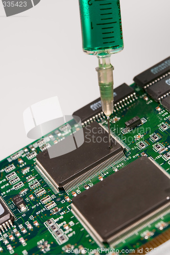 Image of Glass syringe and circuit board