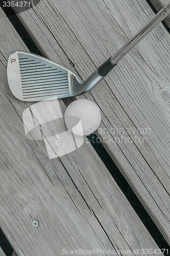 Image of Pitching Wedge And Golf Ball