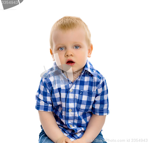 Image of blue-eyed boy in a plaid shirt