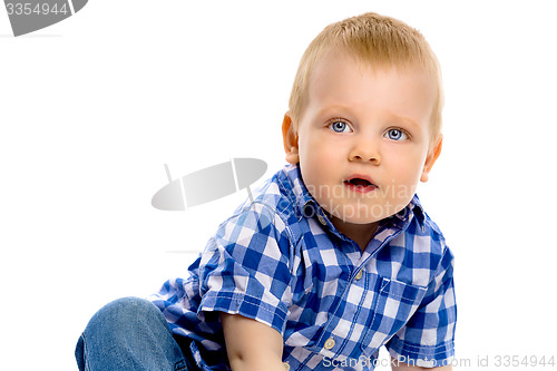 Image of blue-eyed boy in a plaid shirt