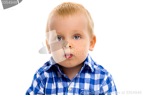 Image of blue-eyed boy in a plaid shirt