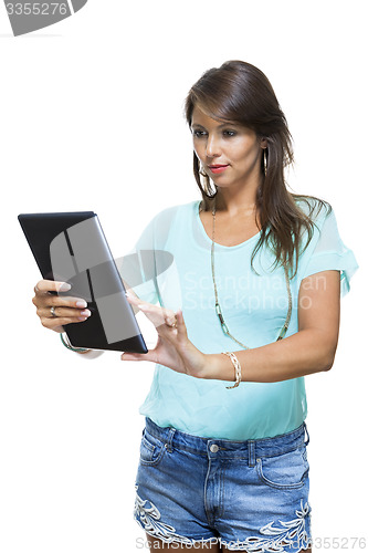 Image of Pretty Woman Browsing at her Tablet Computer