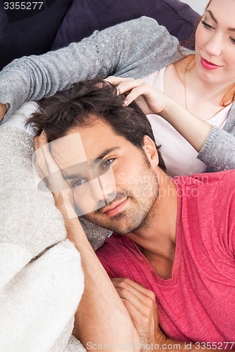 Image of Young Couple Relaxing on Couch In the Living Room