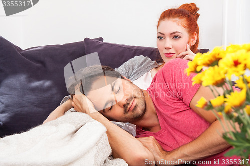 Image of Young Couple Relaxing on Couch In the Living Room