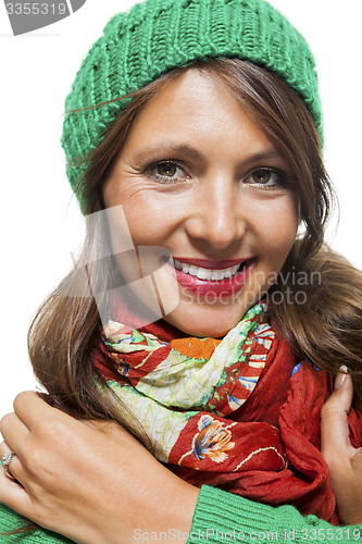 Image of Cute sexy young woman in a green winter outfit