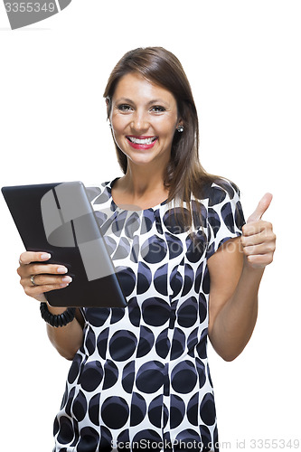 Image of Smiling Woman in a Dress Holding a Tablet Computer