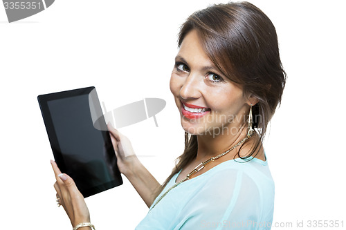 Image of Pretty Woman Browsing at her Tablet Computer