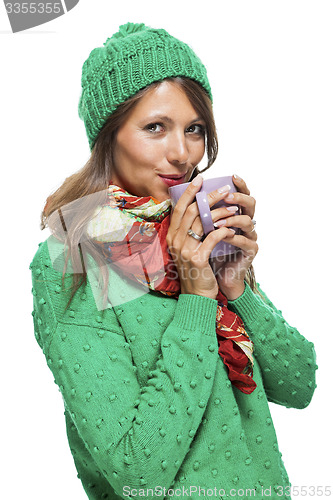 Image of Pretty Woman in Winter Fashion Drinking Coffee