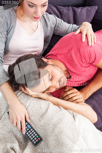 Image of Young Couple Relaxing on Couch In the Living Room