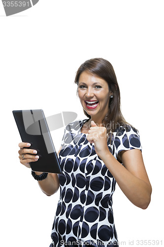 Image of Smiling Woman in a Dress Holding a Tablet Computer