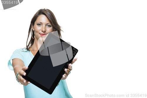 Image of Pretty Woman Browsing at her Tablet Computer