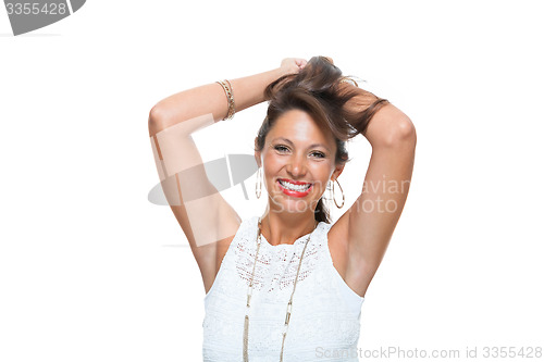 Image of Happy Woman in Trendy Outfit Holding her Hair Up